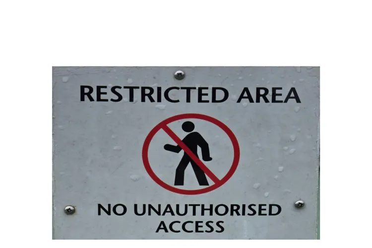 sign saying restricted area  and no unauthorised access 
