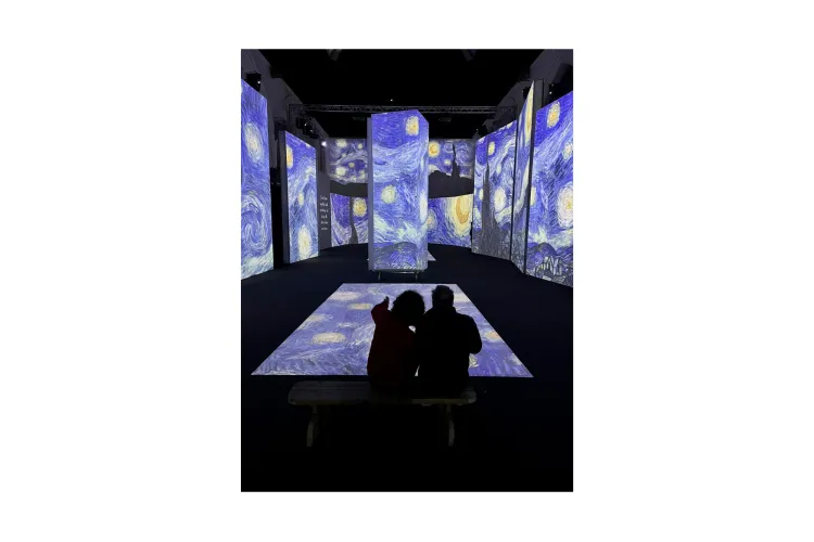 Shadow of 2 people at front of exhibition